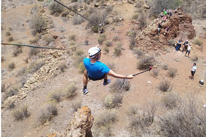 Climbing + Zipline + Via Ferrata + Cave. Adventure route in Gran Canaria - The 50-meter zipline finale: flying and the rock approach