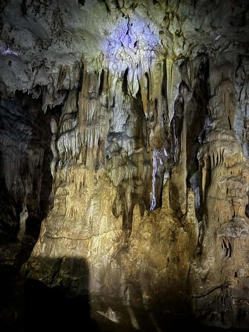 Tirana Adventure: Petrela Castle, Black Cave Hike & Zipline - Black Cave: the guided hike and the short, helmeted cave walk