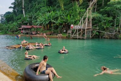Vang Vieng Tour A Blue lagoon 3 with Caves and Zipline - Zipline time in Vang Vieng: sling bridge, treehouse start, and wide off-limits views