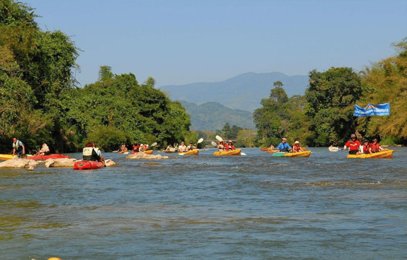 Vang Vieng: Zipline&Kayaking&BlueLagoon 1 - Kayaking the Nam Song River: paddles, small rapids, and riverbank views